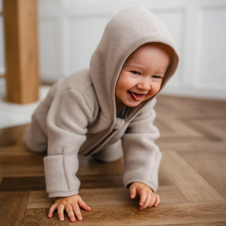 Beige children's overall made of merino wool fleece