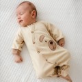 Ecru baby romper with teddy bear embroidery