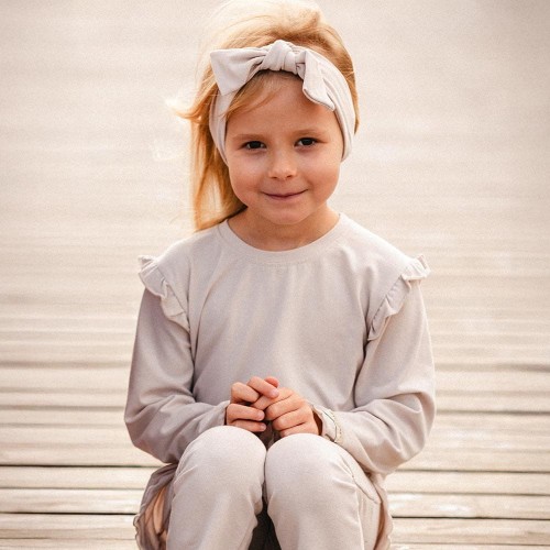 Beige cotton blouse with ruffles on shoulders