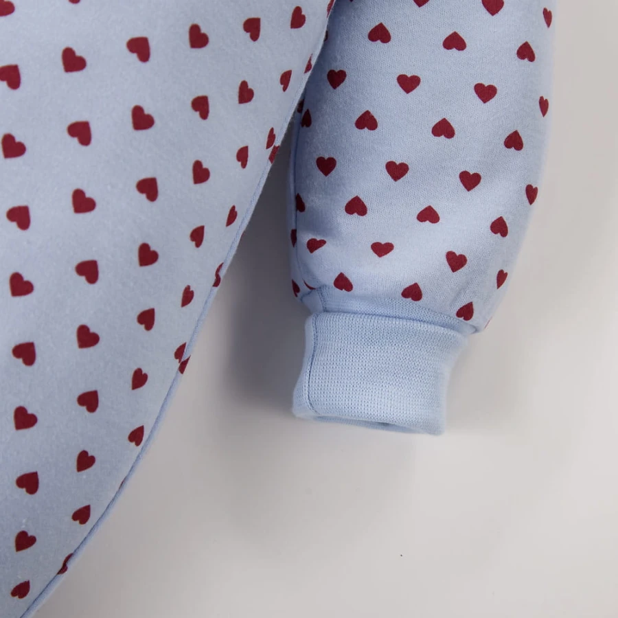 Blue footless baby romper with hearts, grows with your child