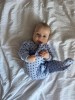 Blue baby sleepsuit with hearts and fold-over sleeves