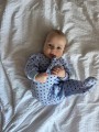 Blue baby sleepsuit with hearts and fold-over sleeves