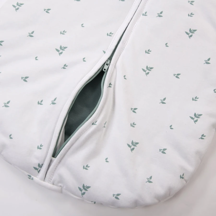 White baby sleeping bag with leaf print