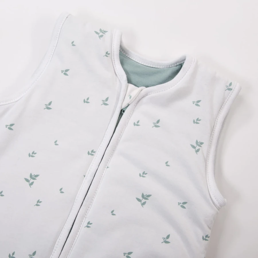 White baby sleeping bag with leaf print