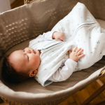 White baby sleeping bag with leaf print