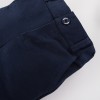 Set bílého košilového body, elegantních tmavomodrých kalhot a tmavomodrého saka