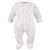 Baby set: bodysuit, footed pants, hat and white sleepsuit with leaf pattern