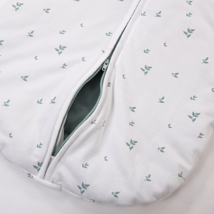 White baby sleeping bag with leaves