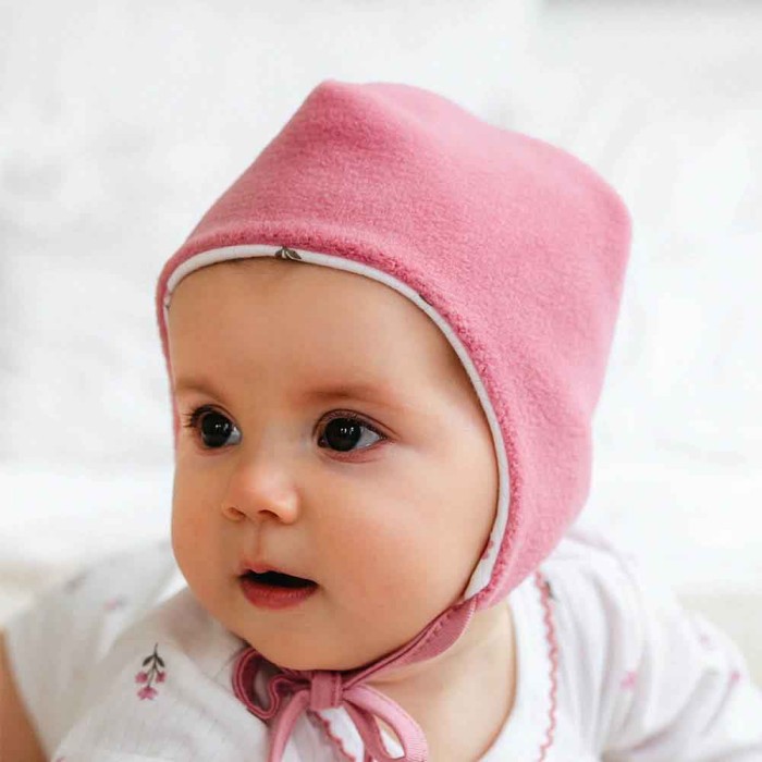 Baby girl’s pink fleece bonnet hat with ties
