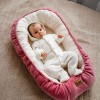 Knitted baby romper with hood ecru