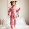 Girls' ruffled pyjama set pink with flowers