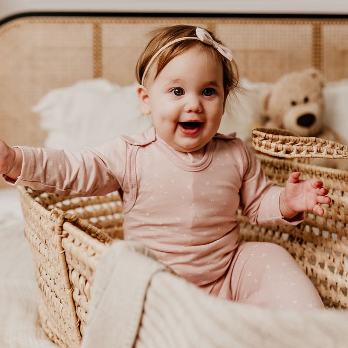 Romper suit pink with flower pattern