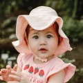 Muslin pink hat with badge