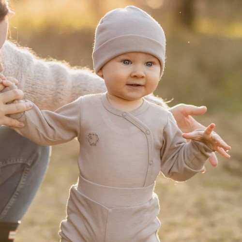 Cardigan baby body from merino wool beige